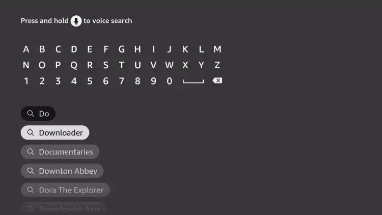 Fire TV on-screen keyboard with Downloader appearing in the search suggestions
